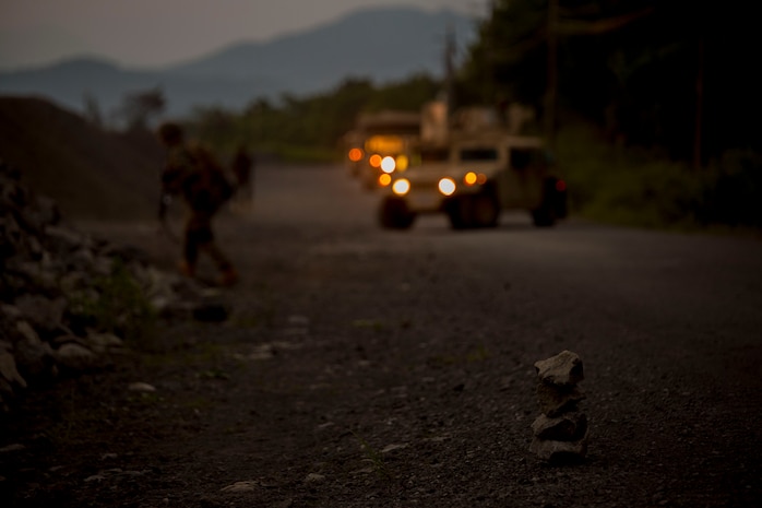 U.S. Marines assigned to Marine Wing Support Squadron (MWSS) 171, based out of Marine Corps Air Station Iwakuni, Japan, discover a potential improvised explosive device while on a security patrol during exercise Eagle Wrath 2017 at Combined Arms Training Center Camp Fuji, Japan, June 16, 2017. Eagle Wrath 2017 is a two-week training evolution focusing on air base ground defense, establishing forward operating bases and forward arming and refueling points in an austere environment as a way to support Marine Aircraft Group 12. (U.S. Marine Corps photo by Lance Cpl. Stephen Campbell)