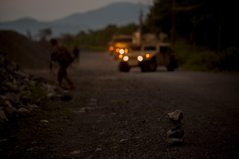 U.S. Marines assigned to Marine Wing Support Squadron (MWSS) 171, based out of Marine Corps Air Station Iwakuni, Japan, discover a potential improvised explosive device while on a security patrol during exercise Eagle Wrath 2017 at Combined Arms Training Center Camp Fuji, Japan, June 16, 2017. Eagle Wrath 2017 is a two-week training evolution focusing on air base ground defense, establishing forward operating bases and forward arming and refueling points in an austere environment as a way to support Marine Aircraft Group 12. (U.S. Marine Corps photo by Lance Cpl. Stephen Campbell)