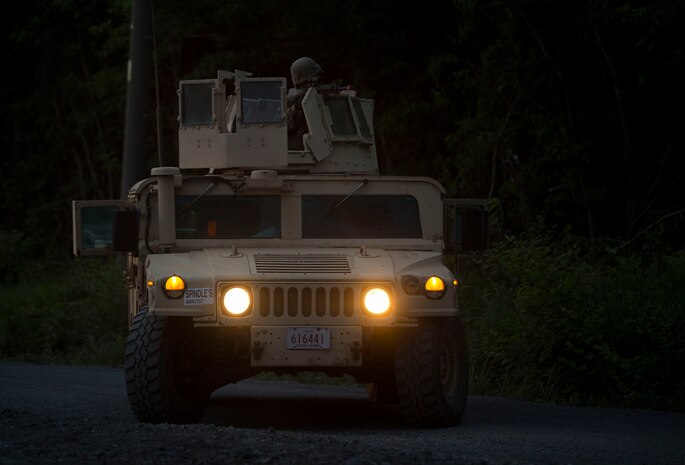 U.S. Marines assigned to Marine Wing Support Squadron (MWSS) 171, based out of Marine Corps Air Station Iwakuni, post security during a security patrol while participating in exercise Eagle Wrath 2017 at Combined Arms Training Center Camp Fuji, Japan, June 16, 2017. Eagle Wrath 2017 is a two-week training evolution focusing on air base ground defense, establishing forward operating bases and forward arming and refueling points in an austere environment as a way to support Marine Aircraft Group 12. (U.S. Marine Corps photo by Lance Cpl. Stephen Campbell)