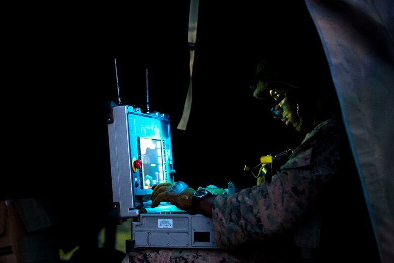 U.S. Marine Corps Staff Sgt. Nijal Dunn, an explosive ordnance disposal technician with Marine Wing Support Squadron (MWSS) 171, based out of Marine Corps Air Station Iwakuni, utilizes an operational control unit to remotely control a PackBot, an unmanned EOD robotic platform, to investigate a potential improvised explosive device during a security patrol while participating in exercise Eagle Wrath 2017 at Combined Arms Training Center Camp Fuji, Japan, June 16, 2017. Eagle Wrath 2017 is a two-week training evolution focusing on air base ground defense, establishing forward operating bases and forward arming and refueling points in an austere environment as a way to support Marine Aircraft Group 12. (U.S. Marine Corps photo by Lance Cpl. Stephen Campbell)