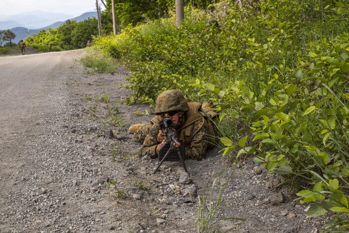 U.S. Marine Corps Lance Cpl. Christopher O’Neal, an expeditionary airfield systems technician with Marine Wing Support Squadron (MWSS) 171, based out of Marine Corps Air Station Iwakuni, posts forward security after a security patrol finds a potential improvised explosive device during exercise Eagle Wrath 2017 at Combined Arms Training Center Camp Fuji, Japan, June 17, 2017. Eagle Wrath 2017 is a two-week training evolution focusing on air base ground defense, establishing forward operating bases and forward arming and refueling points in an austere environment as a way to support Marine Aircraft Group 12. (U.S. Marine Corps photo by Lance Cpl. Stephen Campbell)