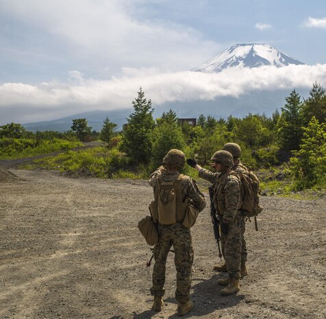 U.S. Marines assigned to Marine Support Squadron (MWSS) 171, based out of Marine Corps Air Station Iwakuni, identify a potential improvised explosive device while on a security patrol during exercise Eagle Wrath 2017 at Combined Arms Training Center Camp Fuji, Japan, June 17, 2017. Eagle Wrath 2017 is a two-week training evolution focusing on air base ground defense, establishing forward operating bases and forward arming and refueling points in an austere environment as a way to support Marine Aircraft Group 12. (U.S. Marine Corps photo by Lance Cpl. Stephen Campbell)