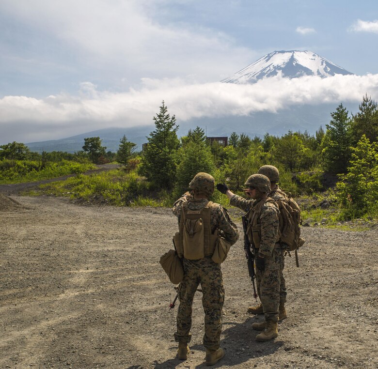 U.S. Marines assigned to Marine Support Squadron (MWSS) 171, based out of Marine Corps Air Station Iwakuni, identify a potential improvised explosive device while on a security patrol during exercise Eagle Wrath 2017 at Combined Arms Training Center Camp Fuji, Japan, June 17, 2017. Eagle Wrath 2017 is a two-week training evolution focusing on air base ground defense, establishing forward operating bases and forward arming and refueling points in an austere environment as a way to support Marine Aircraft Group 12. (U.S. Marine Corps photo by Lance Cpl. Stephen Campbell)