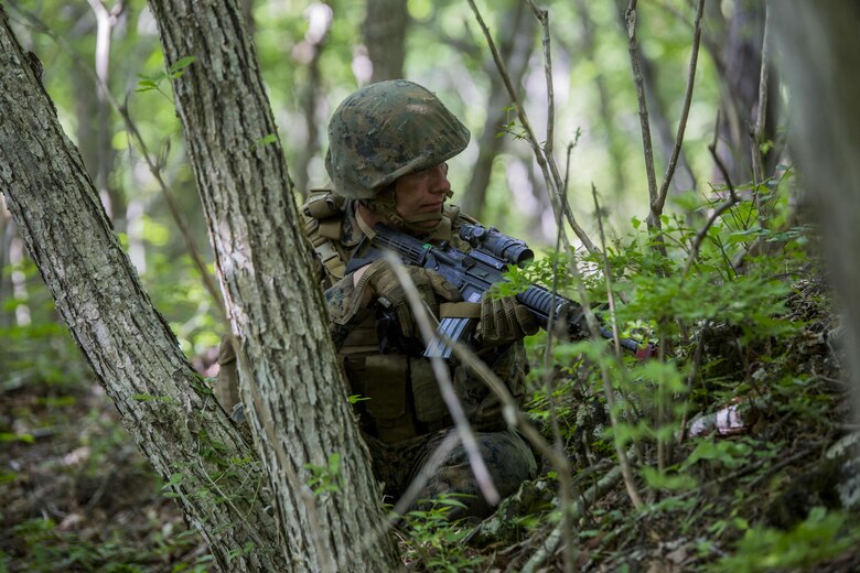 U.S. Marine Corps Lance Cpl. Trysten Harris, a motor transport refueler with Marine Wing Support Squadron (MWSS) 171, posts security during a security patrol while participating in exercise Eagle Wrath 2017 at Combined Arms Training Center Camp Fuji, Japan. Eagle Wrath 2017 is a two-week training evolution focusing on air base ground defense, establishing forward operating bases and forward arming and refueling points in an austere environment as a way to support Marine Aircraft Group 12. (U.S. Marine Corps photo by Lance Cpl. Stephen Campbell)