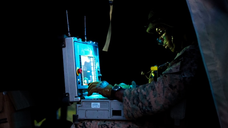 U.S. Marine Corps Staff Sgt. Nijal Dunn, an explosive ordnance disposal technician with Marine Wing Support Squadron (MWSS) 171, based out of Marine Corps Air Station Iwakuni, utilizes an operational control unit to remotely control a PackBot, an unmanned EOD robotic platform, to investigate a potential improvised explosive device during a security patrol while participating in exercise Eagle Wrath 2017 at Combined Arms Training Center Camp Fuji, Japan, June 16, 2017. Eagle Wrath 2017 is a two-week training evolution focusing on air base ground defense, establishing forward operating bases and forward arming and refueling points in an austere environment as a way to support Marine Aircraft Group 12. (U.S. Marine Corps photo by Lance Cpl. Stephen Campbell)