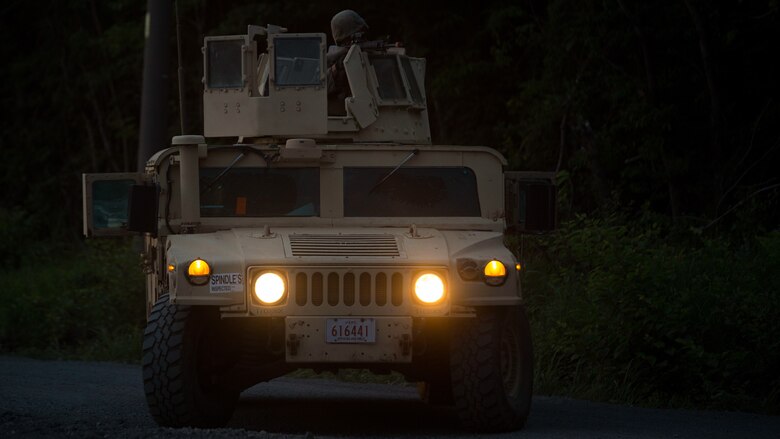 U.S. Marines assigned to Marine Wing Support Squadron (MWSS) 171, based out of Marine Corps Air Station Iwakuni, post security during a security patrol while participating in exercise Eagle Wrath 2017 at Combined Arms Training Center Camp Fuji, Japan, June 16, 2017. Eagle Wrath 2017 is a two-week training evolution focusing on air base ground defense, establishing forward operating bases and forward arming and refueling points in an austere environment as a way to support Marine Aircraft Group 12. (U.S. Marine Corps photo by Lance Cpl. Stephen Campbell)