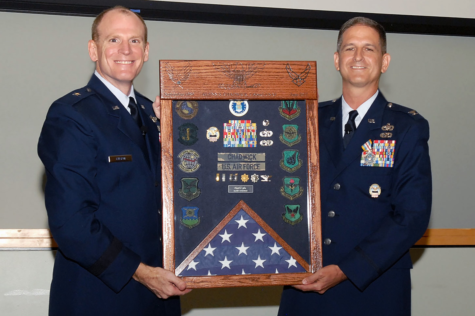 Air Force Brig. Gen. Martin Chapin, DLA Energy commander, presents a shadow box to Col. Glenn Chadwick, DLA Troop Support Industrial Hardware director, at Chadwick’s retirement ceremony June 22. Chadwick served more than 27 years in the Air Force.