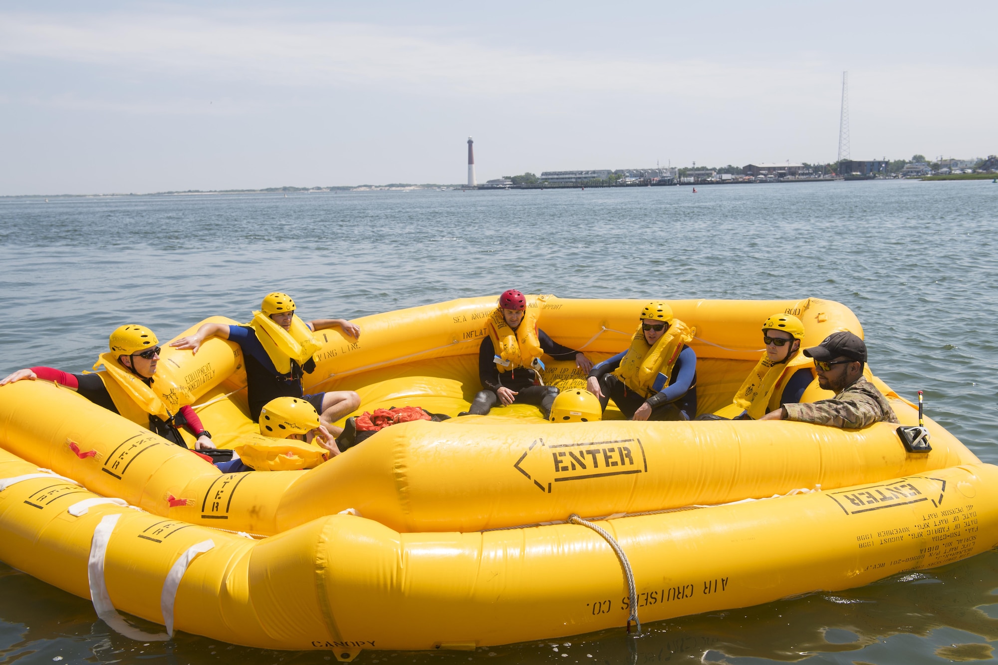 Students of a June 22nd water survival training sit in a raft with their survival, evasion, resistance and escape instructor in Barnegat, N.J. Water survival training is a refresher course that aircrew receive every three years. (U.S. Air Force photo by Senior Airman Joshua King)