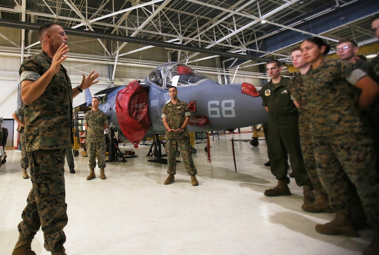 Maj. Gen. Matthew Glavy (left) speaks to Marines assigned to Marine Attack Squadron 542 at Marine Corps Air Station Cherry Point, N.C., June 26, 2017. Glavy talked about how well the Marines are doing in preparing for their upcoming deployment with the 26th Marine Expeditionary Unit. Leading up to the deployment the Marines assigned to the squadron have conducted approximately 2,500 maintenance hours and worked 12 hour days every day of the week. Glavy is the commanding general of 2nd Marine Aircraft Wing. VMA-542 is assigned to Marine Aircraft Group 14, 2nd MAW.  (U.S. Marine Corps Photo by Pfc. Skyler Pumphret/ Released)