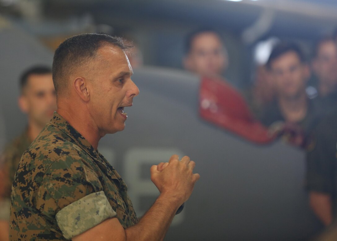 Maj. Gen. Matthew Glavy (left) speaks to Marines assigned to Marine Attack Squadron 542 at Marine Corps Air Station Cherry Point, N.C., June 26, 2017. Glavy talked about how well the Marines are doing in preparing for their upcoming deployment with the 26th Marine Expeditionary Unit. Leading up to the deployment the Marines assigned to the squadron have conducted approximately 2,500 maintenance hours and worked 12 hour days every day of the week. Glavy is the commanding general of 2nd Marine Aircraft Wing. VMA-542 is assigned to Marine Aircraft Group 14, 2nd MAW.  (U.S. Marine Corps Photo by Pfc. Skyler Pumphret/ Released)