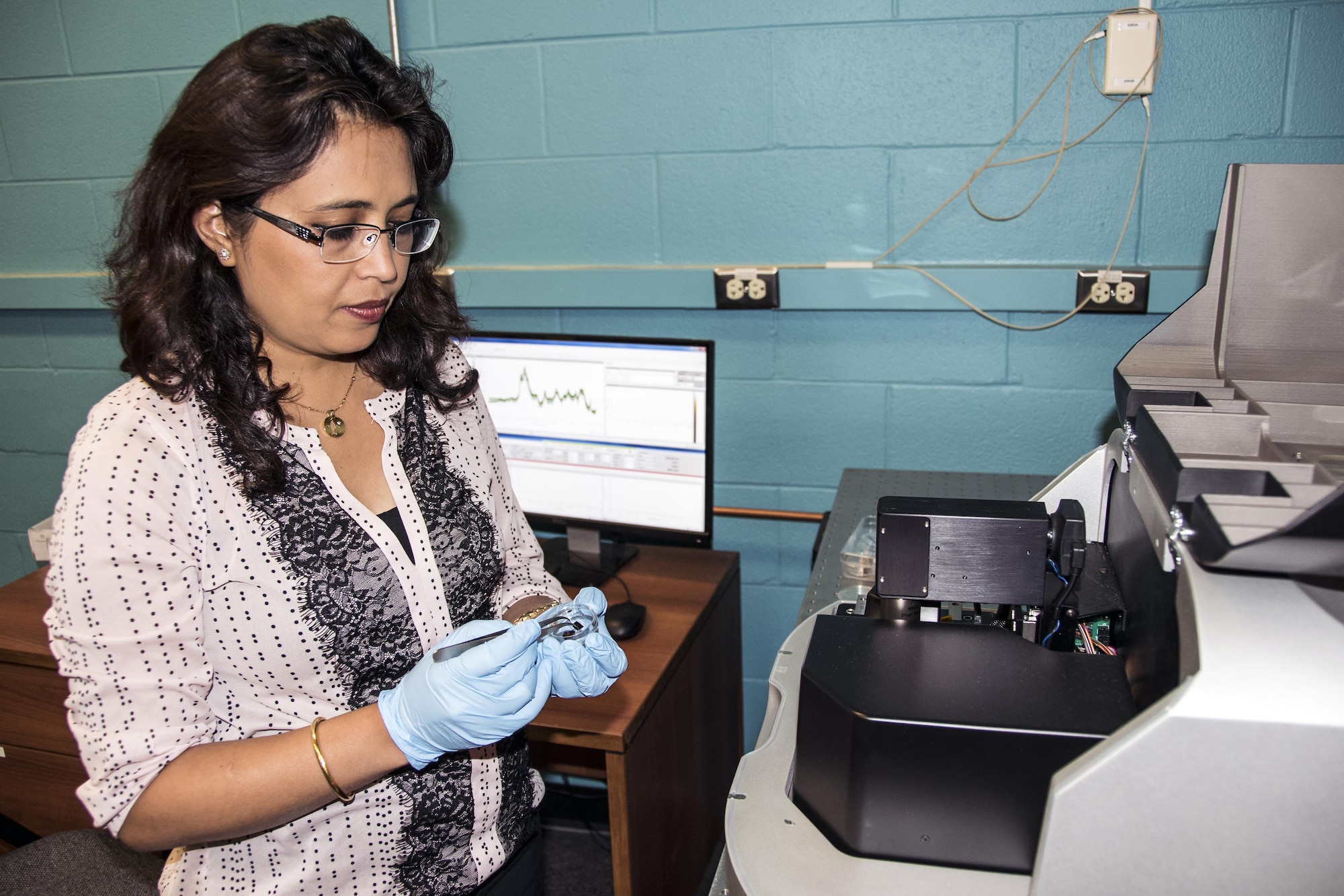 Air Force Research Laboratory research materials engineer Dr. Dhriti Nepal of the AFRL Composites Performance team performs nano-IR characterization of a nanocomposite material in the microscopy laboratory. (U.S. Air Force photo/David Dixon)