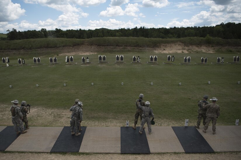 U.S. Army Reserve military police with the 354th MP Company from St. Louis, Missouri participate in reflexive fire training during Guardian Justice at Fort McCoy, Wisconsin, June 23. Guardian Justice is a functional exercise, broken down into two-week cycles, centered on squad and team-level training with a focus on internment, resettlement, detainee operations and combat support. During each two-week cycle, Soldiers train on internment operations, weapons qualification, biometrics, reflexive fire, Military Operations on Urbanized Terrain (MOUT), non-lethal Tasers, MP battle drills and situational training exercises. (U.S. Army Reserve photo by Sgt. Audrey Hayes)