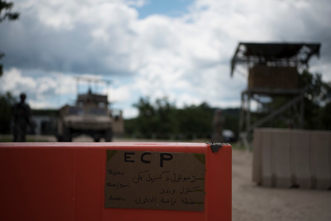 A sign is posted in three different Middle-Eastern languages at the entry of a mock detention facility during Guardian Justice at Fort McCoy, Wisconsin, June 24. Guardian Justice is a functional exercise, broken down into two-week cycles, centered on squad and team-level training with a focus on internment, resettlement, detainee operations and combat support. During each two-week cycle, Soldiers train on internment operations, weapons qualification, biometrics, reflexive fire, Military Operations on Urbanized Terrain (MOUT), non-lethal Tasers, MP battle drills and include a situational training exercise. (U.S. Army Reserve photo by Sgt. Audrey Hayes)