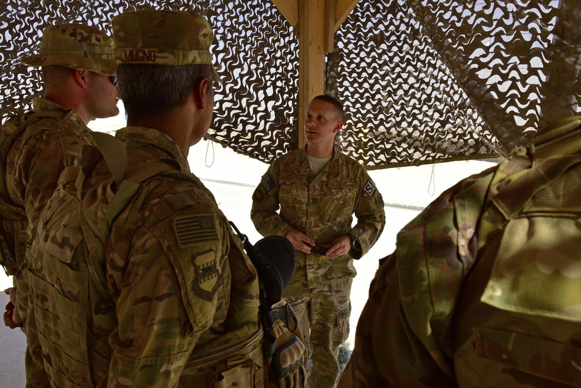 Capt. Jeffrey Robertson, 407th Expeditionary Security Forces Squadron operations officer, speaks to Airmen assigned to the 443d ESFS June 22, 2017, at Al Asad Airbase. Robertson visited security forces members at Al Asad to check on his Airmen forward deployed there and the current status and capabilities of the unit to accomplish the mission.(U.S. Air Force photo by Senior Airman Ramon A. Adelan)
