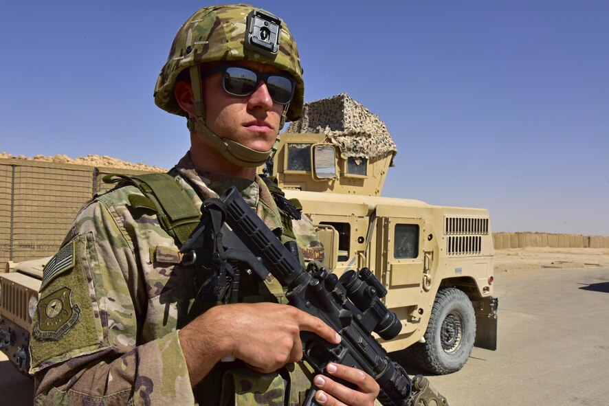 Senior Airman Kieth Catt, 407th Expeditionary Security Forces Squadron member, guards an entry control point June 22, 2017, at Al Asad Airbase, Iraq. Catt and 11 other members forward deployed to the 443d ESFS at Al Asad providing flightline security, entry control, base defense operations and close boundary sentry duty.(U.S. Air Fore photo by Senior Airman Ramon A. Adelan)