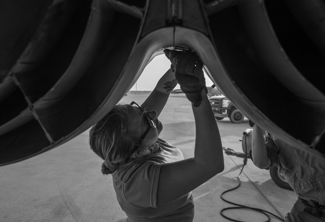 A maintainer, assigned the 23rd Expeditionary Aircraft Maintenance Unit, performs maintenance on a B-52 Stratofortress at an undisclosed location in Southwest Asia, June 15, 2017. The 23rd EAMU provided the 400th consecutive sortie without a maintenance cancellation on the day the 23rd Expeditionary Bomb Squadron celebrated the 100th anniversary of the unit. (U.S. Air Force photo by Staff Sgt. Trevor T. McBride)