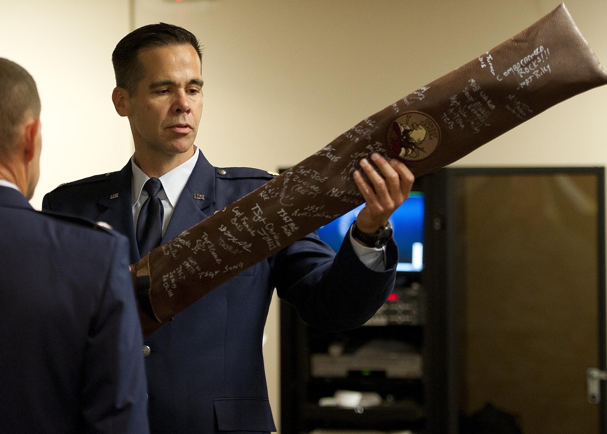 U.S. Air Force Maj. Hamilton Underwood removes the cover of the 4th Combat Camera Squadron guidon before he assumes command of the newly activated 4th CTCS at Joint Base Charleston, South Carolina, May 5, 2017. The 4th CTCS was reactivated in South Carolina after being deactivated August 2015 in California. (U.S. Air Force photo by Tech. Sgt. Stephen D. Schester) 