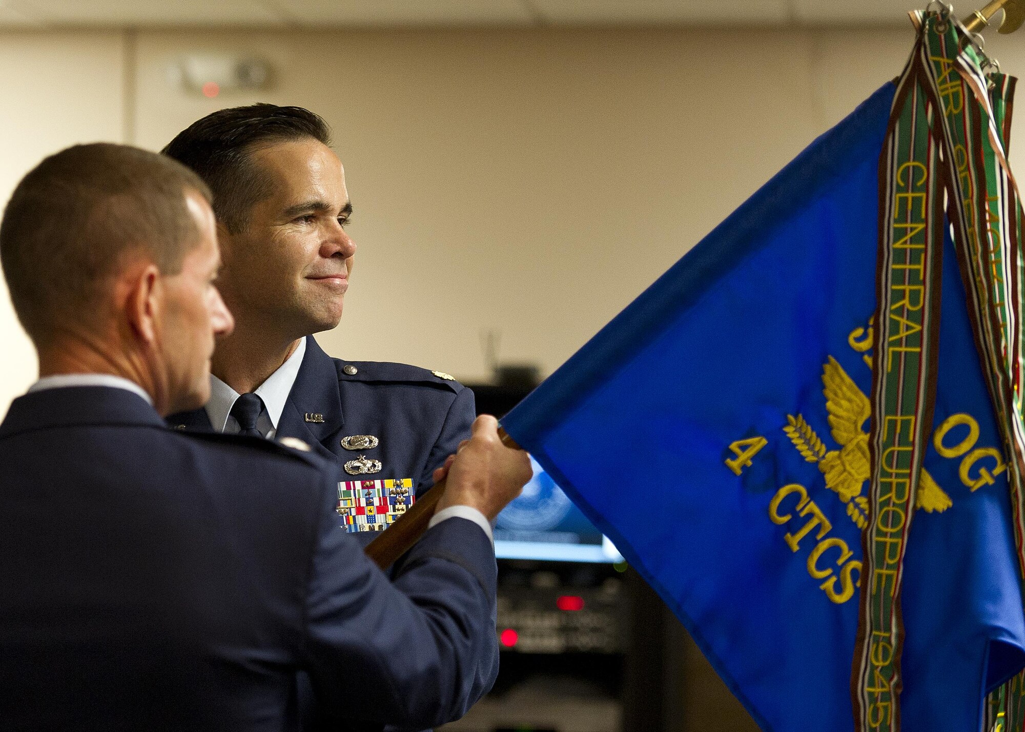 U.S. Air Force Maj. Hamilton Underwood receives the guidon and assumes command of the newly activated 4th Combat Camera Squadron from Lt. Col. John Robinson, commander of the 315th Operations Group, at Joint Base Charleston, South Carolina, May 5, 2017. The 4th CTCS was reactivated in South Carolina after being deactivated August 2015 in California. (U.S. Air Force photo by Tech. Sgt. Stephen D. Schester) 