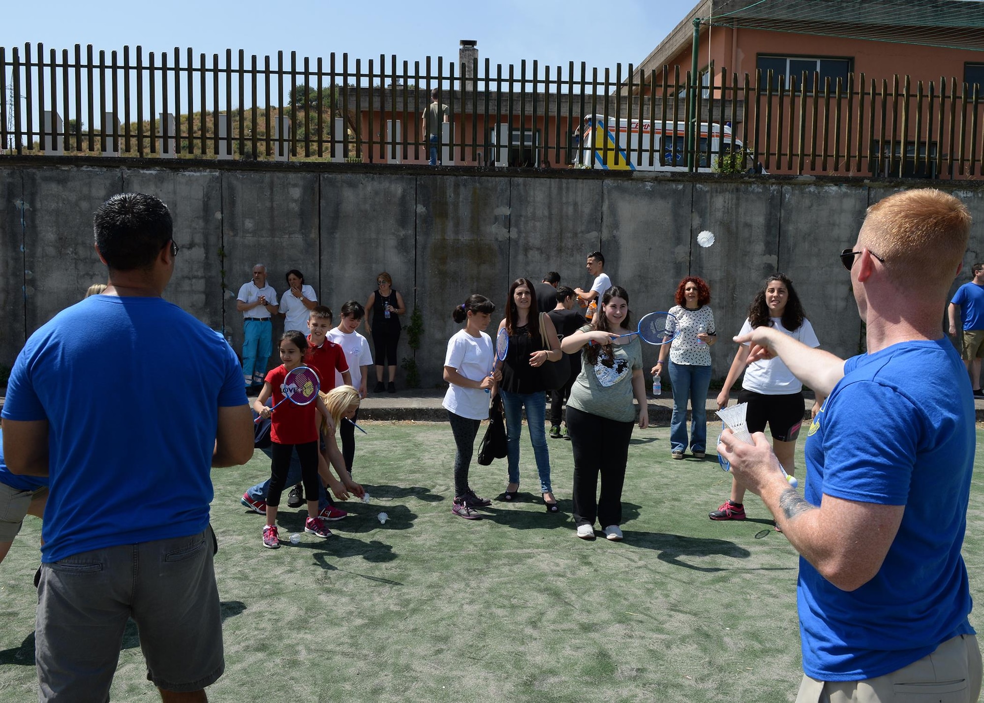 Airmen deployed to the 324th Expeditionary Reconnaissance Squadron toss shuttlecocks for a badminton exercise during a Special Olympics event in Catania, Sicily, June 7, 2017. Volunteers helped create and run events for more than 60 children who participated in the first event of its kind in the area. (U.S. Air Force photo by Senior Airman Jimmie D. Pike)
