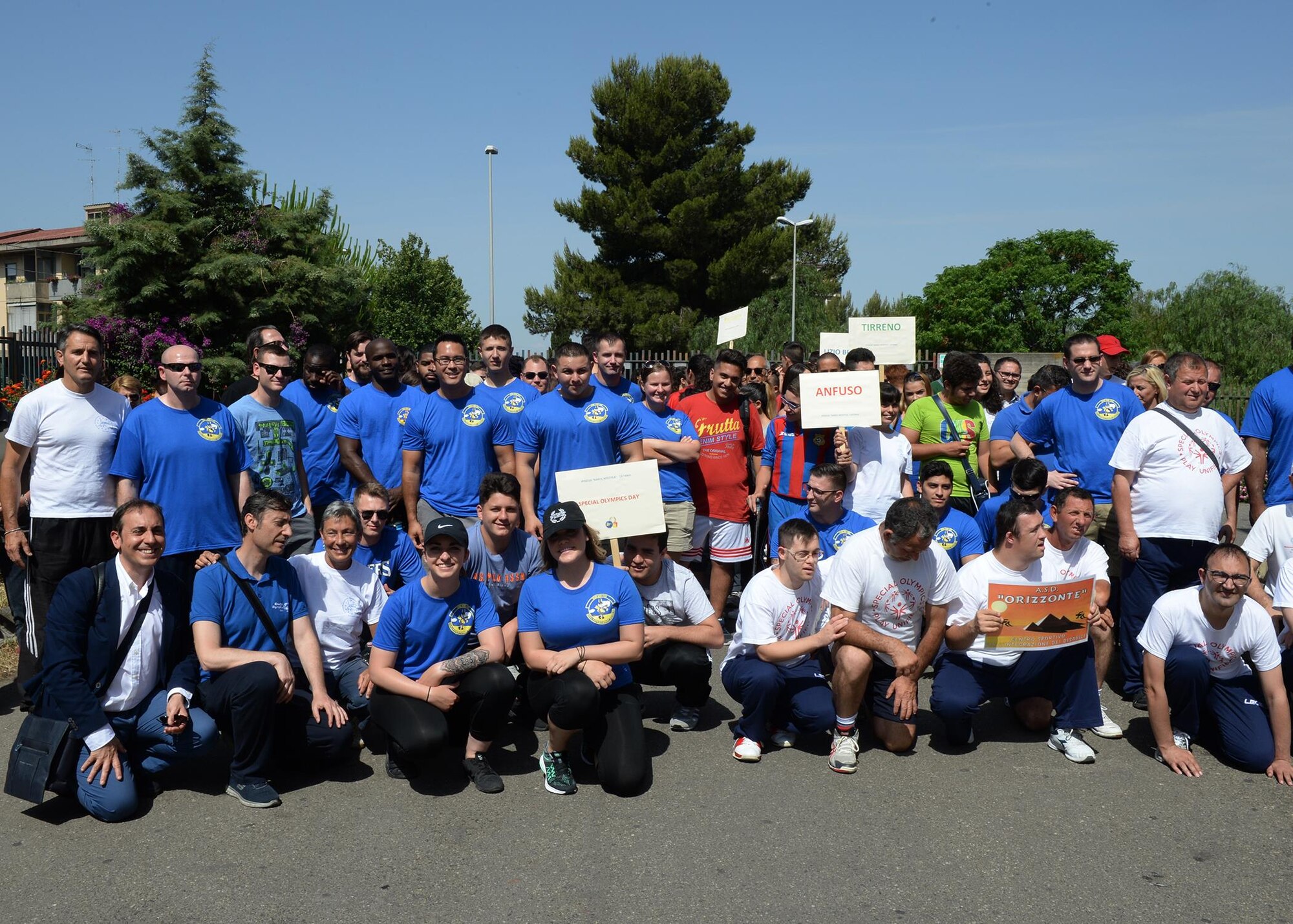 Sicilians and Airmen deployed to the 324th Expeditionary Reconnaissance Squadron pose for a picture before a Special Olympics event in Catania, Sicily, June 7, 2017. More than 40 deployed Airmen helped to plan, coordinate, set-up, and run the event for children with disabilities. (U.S. Air Force photo by Senior Airman Jimmie D. Pike)