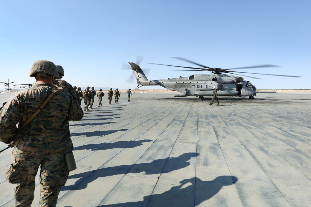 Marine Reservists prepare to board a CH-53E Super Stallion helicopter during an air assault course as part of the final battalion exercise of Integrated Training Exercise 4-17 at Camp Wilson, Marine Air Ground Combat Center, Twentynine Palms, Calif., June 21, 2017. The helicopter crew is assigned to Heavy Marine Helicopter Squadron 772, Marine Aircraft Group, 4th Marine Air Wing. Marine Corps photo by Lance Cpl. Stanley Moy 