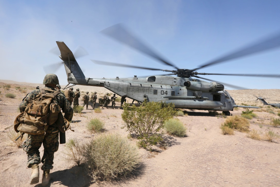 Marine Reservists board a CH-53E Super Stallion helicopter after participating in an air assault course during the final battalion exercise of Integrated Training Exercise 4-17 at Camp Wilson, Marine Air Ground Combat Center, Twentynine Palms, Calif., June 21, 2017. Marine Corps photo by Lance Cpl. Stanley Moy