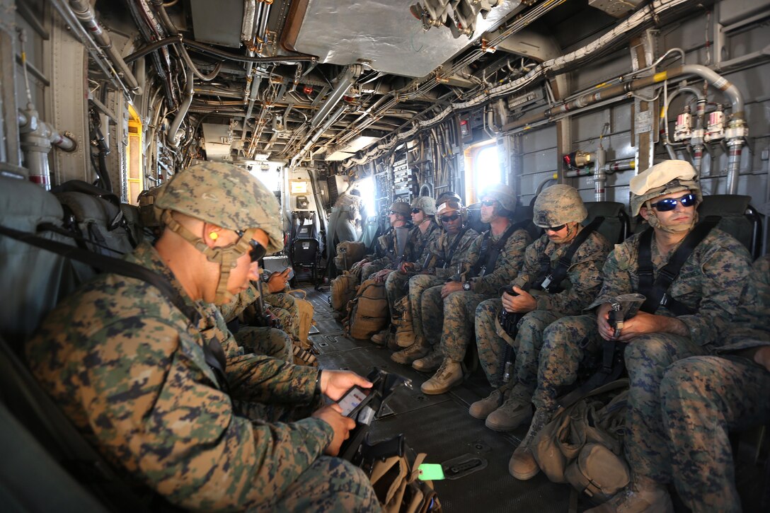 Marines ride on a CH-53E Super Stallion helicopter after participating in an air assault course during the final battalion exercise of Integrated Training Exercise 4-17 at Camp Wilson, Marine Air Ground Combat Center, Twentynine Palms, Calif., June 21, 2017. Marine Corps photo by Lance Cpl. Stanley Moy