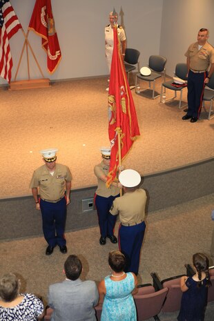 Marines from Recruiting Station St. Louis pass the command organizational colors during a change of command ceremony at Marine Corps Recruiting Station St. Louis, St. Louis, Mo. on June 23, 2017. Major Nicole Bastian took command of the recruiting station relieving Maj. Ian Duncan. (USMC Photo by Cpl. Zachery B. Martin)