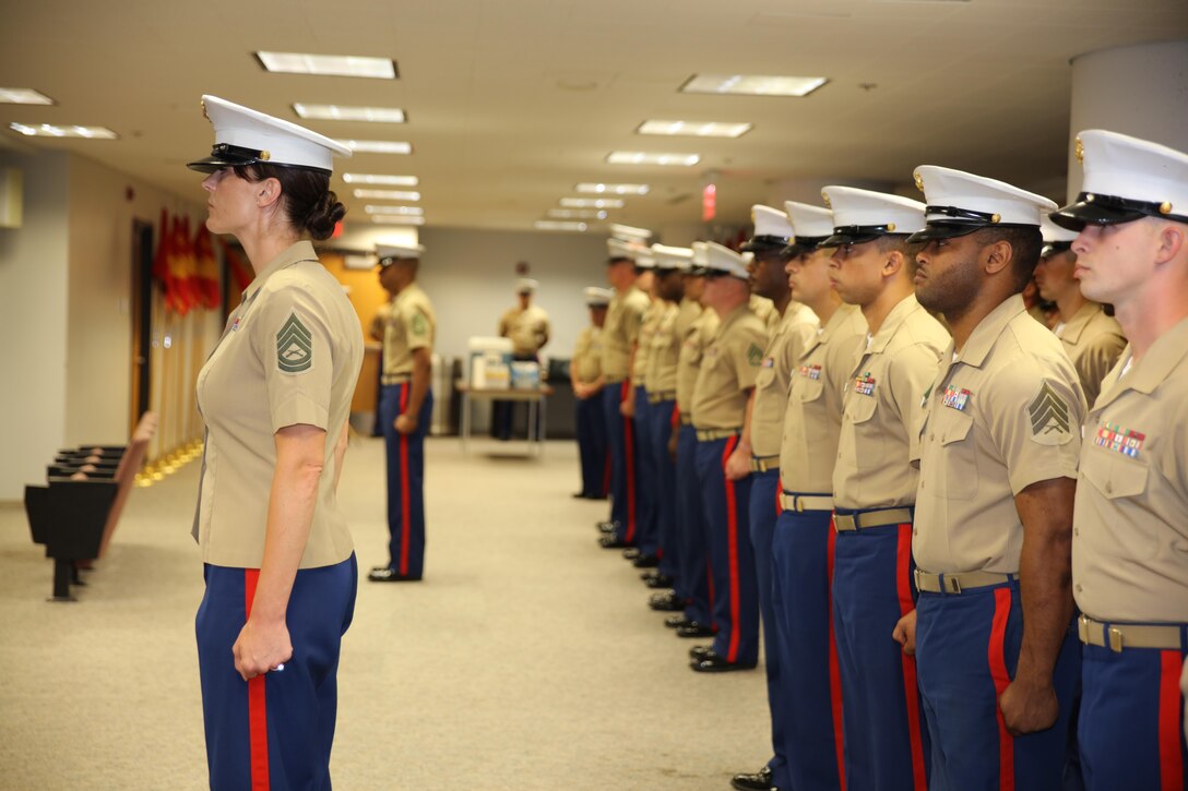 Marines from Recruiting Station St. Louis pass the command organizational colors during a change of command ceremony at Marine Corps Recruiting Station St. Louis, St. Louis, Mo. on June 23, 2017. Major Nicole Bastian took command of the recruiting station relieving Maj. Ian Duncan. (USMC Photo by Cpl. Zachery B. Martin)