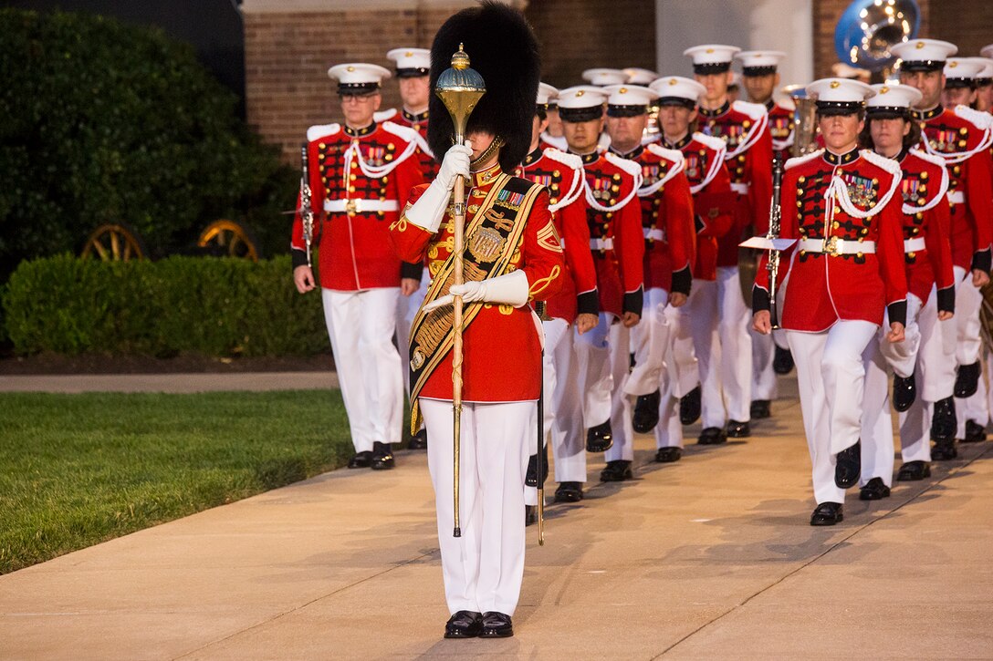 Gunnery Sgt. Stacie Crawford, assistant drum major, “The President’s Own” U.S. Marine Band, marches the band onto center walk during a Friday Evening Parade at Marine Barracks Washington D.C., June 23, 2017. The guest of honor for the parade was Lt. Gen. Thomas Trask, vice commander, United States Special Operations Command, and the hosting official was Lt. Gen. James Laster, director, Marine Corps Staff. (Official Marine Corps photo by Cpl. Robert Knapp/Released)
