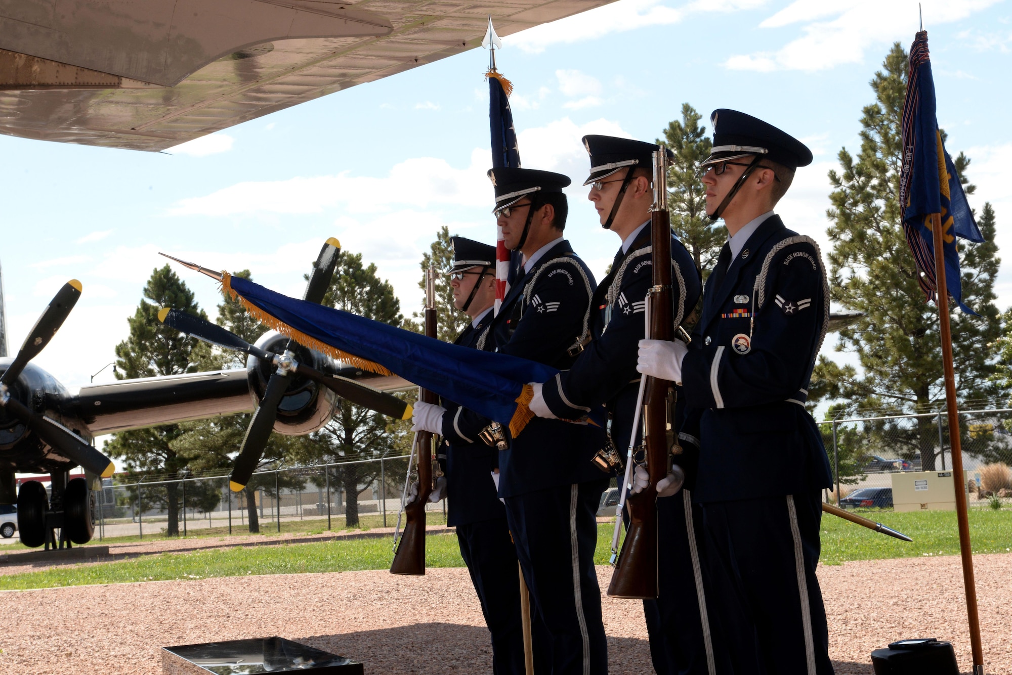 Honor Guard members from Ellsworth Air Force Base, S.D., present the colors during a memorial dedication and anniversary event at the South Dakota Air and Space Museum, Box Elder, S.D., June 24, 2017. The mission of the Ellsworth Honor Guard is to act as representatives for Airmen to both the American public and the world. (U.S. Air Force photo by Staff Sgt. Hailey Staker)
