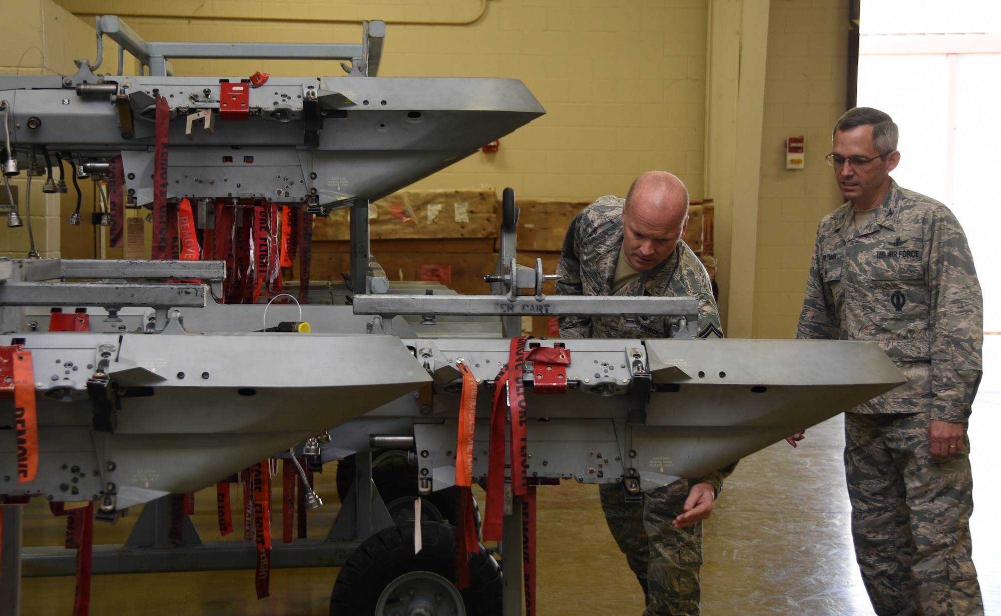 Senior Master Sgt Raymond Knox, 301st Maintenance Armament Flight Chief, explains the use of the Triple Ejector Rack (TER-9A) platform and its weapon load capability to Col. Damon Feltman, Tenth Air Force vice commander, during a unit visit here May 15, 2017. Platforms, like the TER-9A, turn aircraft into a combat-ready fleet.
