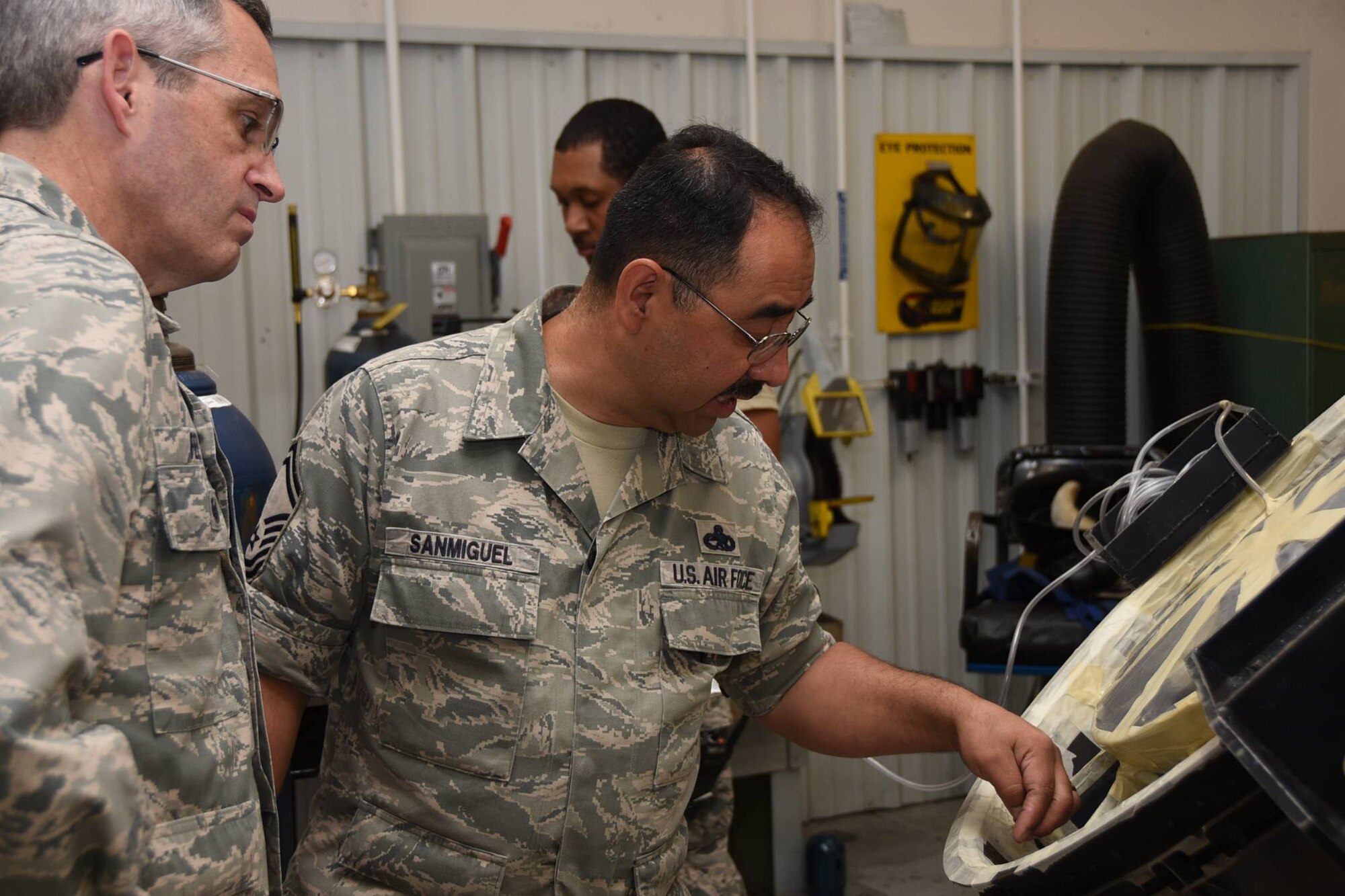 Senior Master Sgt. Jesus San Miguel, 301st Structural Maintenance Section chief, talks to Col. Damon Feltman, Tenth Air Force vice commander, during a unit visit here May
15, 2017, about the second engine turbine frame brought to the metals technology shop. San Miguel and his team repair cracks, exceeding operational limits, around the frame's perimeter using Tungsten Inert Gas (TIG) methods. The cost-saving repair allows the propulsion shop to re-install the improved frame with little time lost on the assembly of a complete jet engine.
