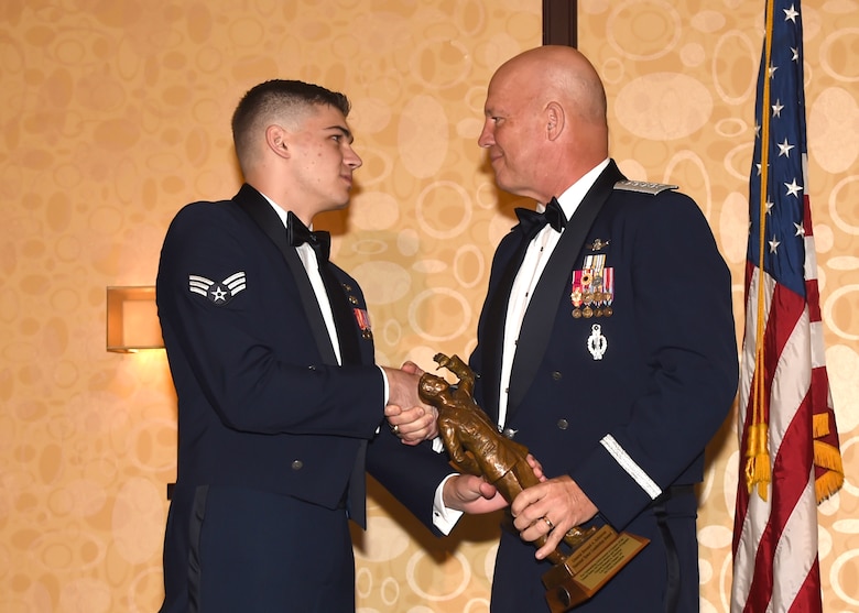Air Force Gen. Jay Raymond, Commander, Air Force Space Command, receives the General Bernard A. Schriever Space Leadership Award, presented by space pioneer Gen. Bernard A. Schriever's great-grandson, Senior Amn. Brett Schriever, during the Air Force Association's 43nd Annual Salute to SMC Banquet, held in El Segundo Calif., June 9, 2017. (U.S. Air Force photo/Sarah Corrice)