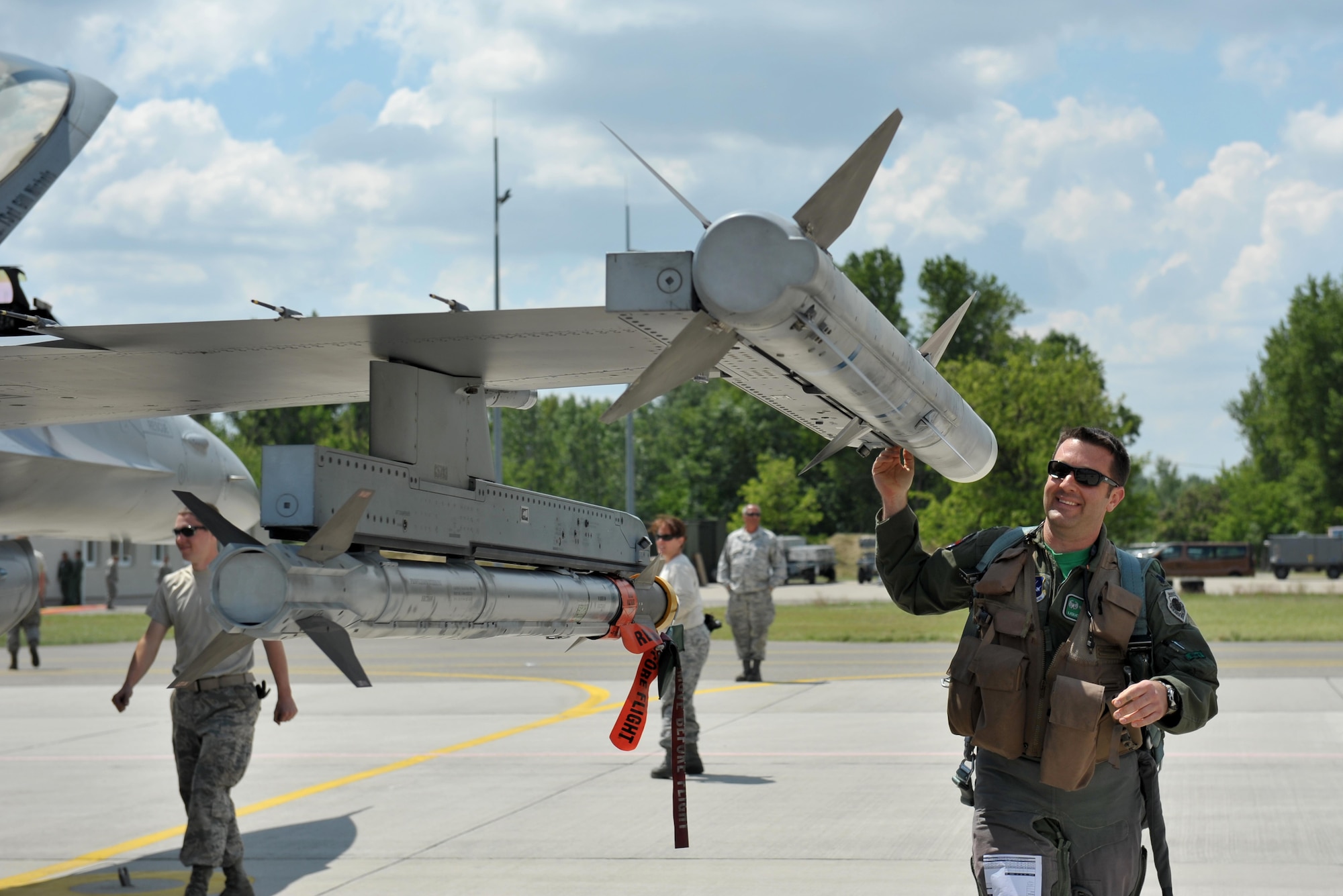Lt. Col. Gregory Barasch, an F-16 Fighting Falcon pilot assigned to the 180th Fighter Wing, Ohio Air National Guard, conducts a preflight inspection prior to a morning sortie, May 25, 2017, at Kecskemet Air Base in Hungary. Approximately 150 Airmen and eight F-16 fighter jets from the 180FW traveled to the air base to participate in Load Diffuser 17, a two-week Hungarian-led multinational exercise focused on enhancing interoperability capabilities and skills among NATO allied and European partner air forces by conducting joint operations and air defenses to maintain joint readiness, while also bolstering relationships within the U.S. Air National Guard’s State Partnership Program initiatives. Ohio became state partners with Hungary in 1993. Air National Guard photo by Senior Master Sgt. Beth Holliker.