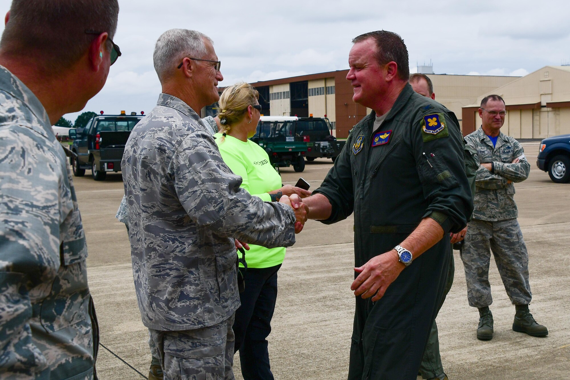 Lt. Col. Dwayne W. Slack, the 307th Maintenance Group deputy commander, congratulates Col. Bruce R. Cox, the 307th Bomb Wing commander, after his final flight out of Barksdale Air Force Base, La. June 24, 2017. Cox will be retiring in July after serving more than 31 years in the Air Force. (U.S. Air Force photo by Master Sgt. Dachelle Melville/Released)