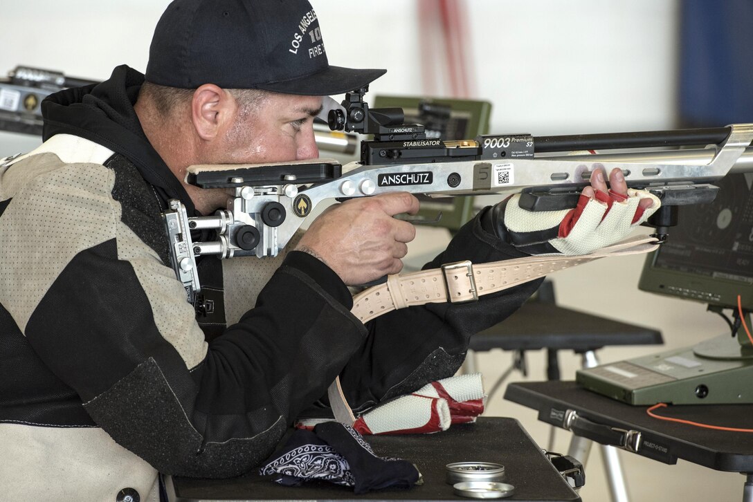 A service member aims a rifle during U.S. Special Operations Command’s training camp at MacDill Air Force Base, Fla., May 16, 2017. DoD photo by Roger L. Wollenberg