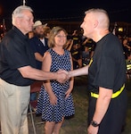 Brooke Army Medical Center Commander Brig. Gen. Jeffrey Johnson shakes hands with Jim Case and Christy McWethy-Case at a ceremony June 23 honoring her brother, Spc. 5 Edgar Lee McWethy Jr. at the McWethy Troop Medical Clinic on Joint Base San Antonio-Fort Sam Houston. McWethy received the Medal of Honor posthumously for his heroic actions June 21, 1967 during the Vietnam War.
