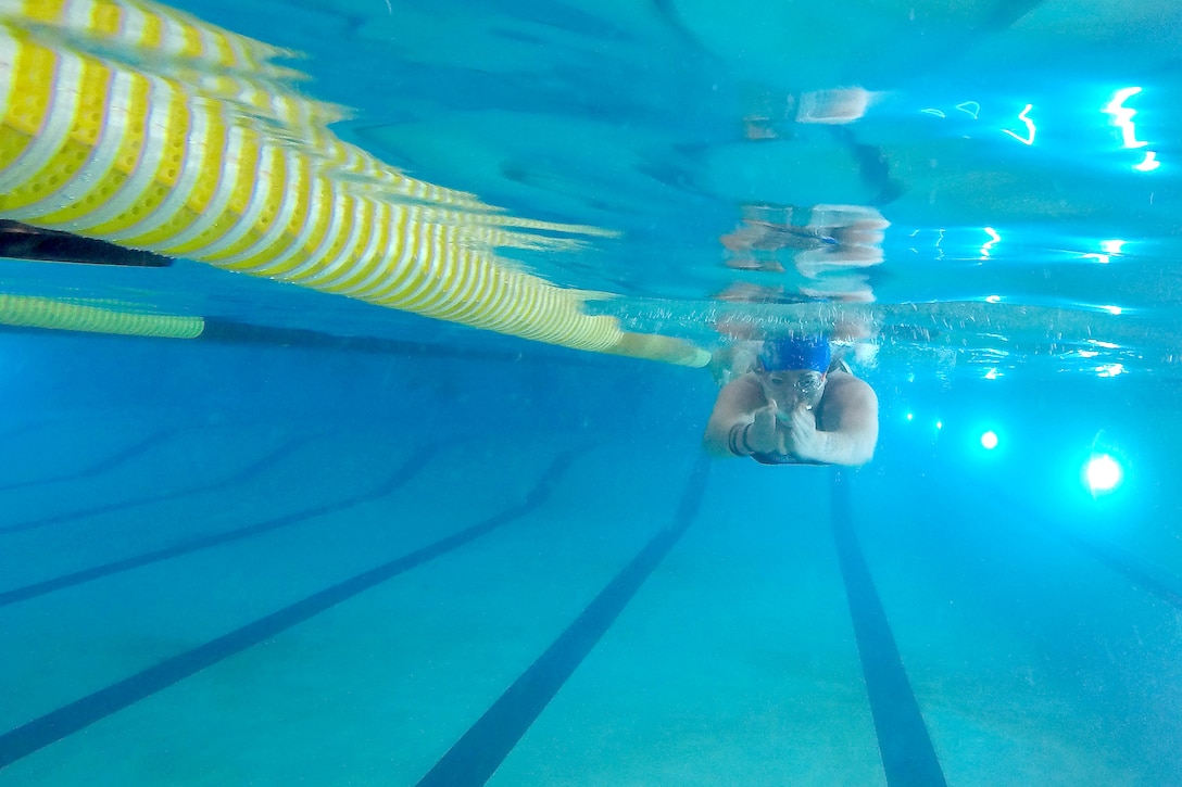 A soldier swims during the Army Warrior Games training camp at Fort Bliss, Texas, June 7, 2017. DoD photo by Roger L. Wollenberg