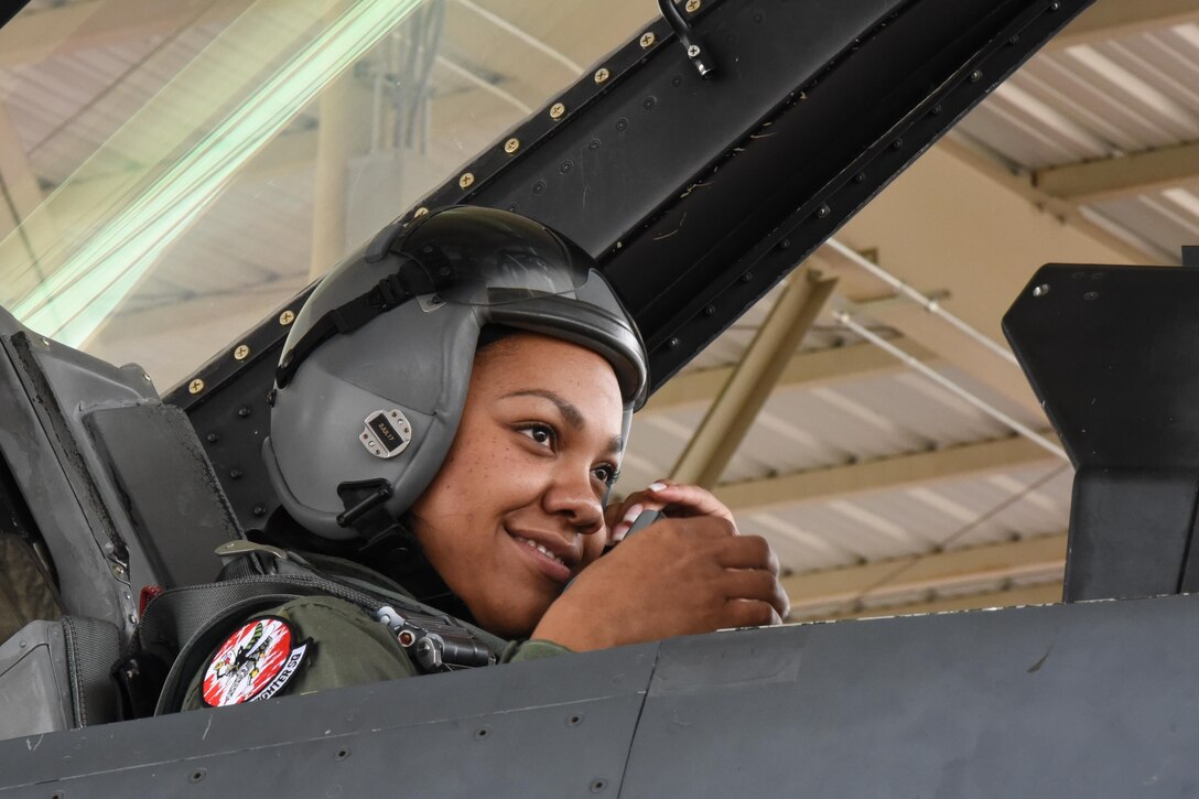 Staff Sgt. Natashja Hardin, 301st Maintenance Squadron, adjusts her helmet for a snug fit before receiving her incentive flight April 20, 2017, for being the 301st Fighter Wing's NCO of the Quarter from April-June 2016 at Naval Air Station Fort Worth Joint Reserve Base, Texas. Incentive flights provide Airmen first-hand experience on how their job fits into the mission. (U.S. Air Force photo by Ms. Julie Briden-Garcia)
