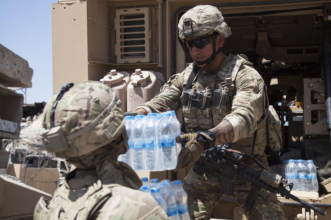 Soldiers unload supplies at a new patrol base established with Iraqi forces in Mosul, Iraq, June 19, 2017. Army photo by Cpl. Rachel Diehm