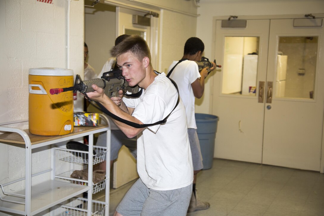 Students toting red-tipped Airsoft rifles learned the art of clearing a building, going room to room in the old Marine barracks to flush out suspects and eliminate threats, June 13.