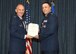 Col. Ryan Samuelson, 92nd Air Refueling Wing commander presents the Meritorious Service Medal award to Lt. Col. Khalim Taha, 92nd Comptroller Squadron commander, during the 92nd CPTS change of command ceremony June 26, 2017, at Fairchild Air Force Base, Washington. Taha will be going to Wright-Patterson AFB, Ohio. (U.S. Air Force photo/Staff Sgt. Samantha Krolikowski)