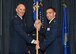 Col. Ryan Samuelson, 92nd Air Refueling Wing commander, passes the 92nd Comptroller Squadron guidon to Maj. Phillip Roth, 92nd CPTS commander, during a change of command ceremony June 26, 2017, at Fairchild Air Force Base, Washington. Roth assumed command from Lt. Col. Khalim Taha. (U.S. Air Force photo/Staff Sgt. Samantha Krolikowski) 
