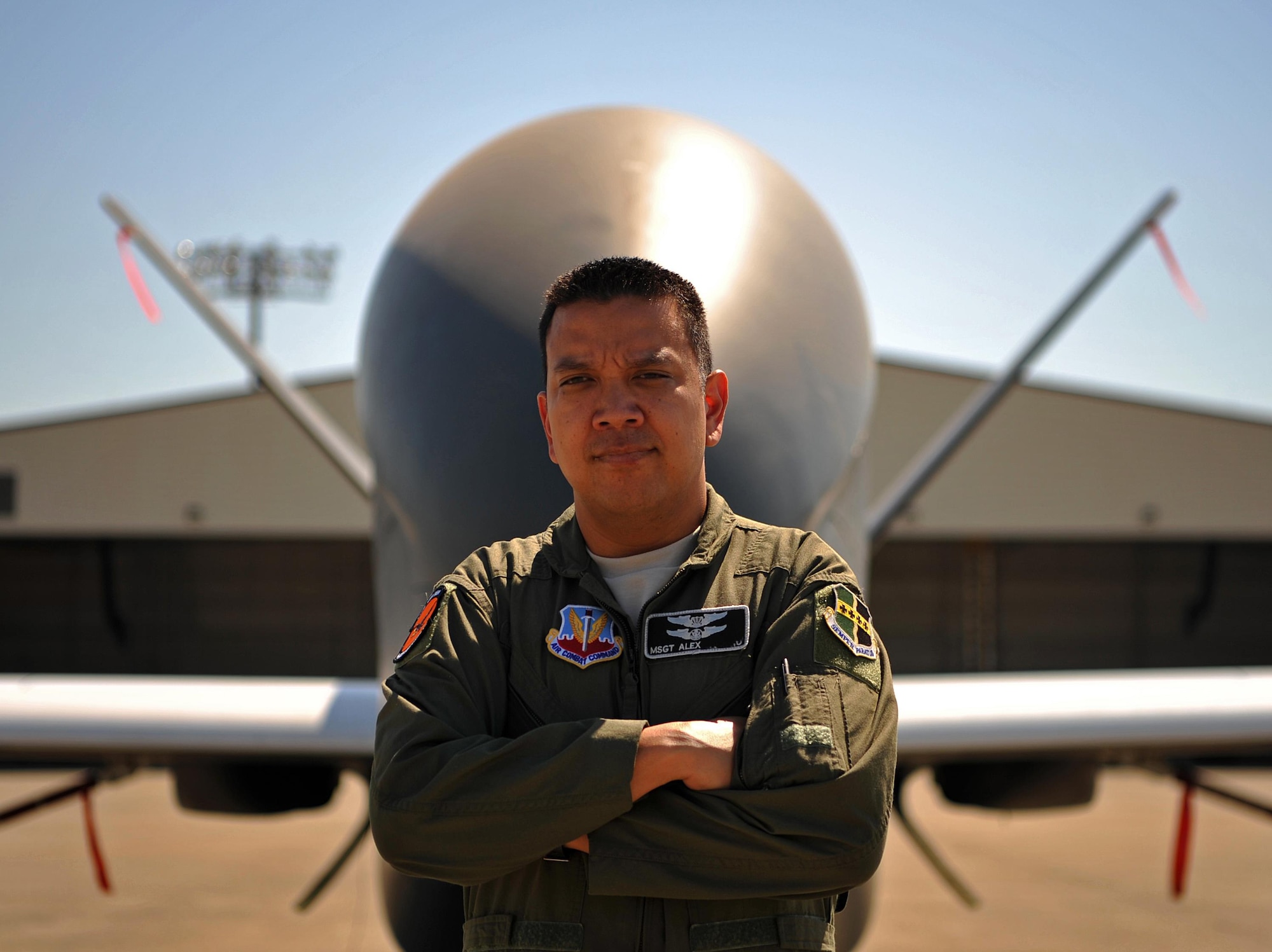 Master Sgt. Alex, 12th Reconnaissance Squadron student pilot, poses for a photo in front of a RQ-4 Global Hawk June 21, 2017 at Beale Air Force Base, California. Alex was previously a sensor operator on the RQ-4 who was stationed at Beale before going through all of the training to become a remotely piloted aircraft pilot. He has returned to Beale to finish his training to become an enlisted pilot and fly the RQ-4. (U.S. Air Force photo/Airman 1st Class Tristan D. Viglianco)