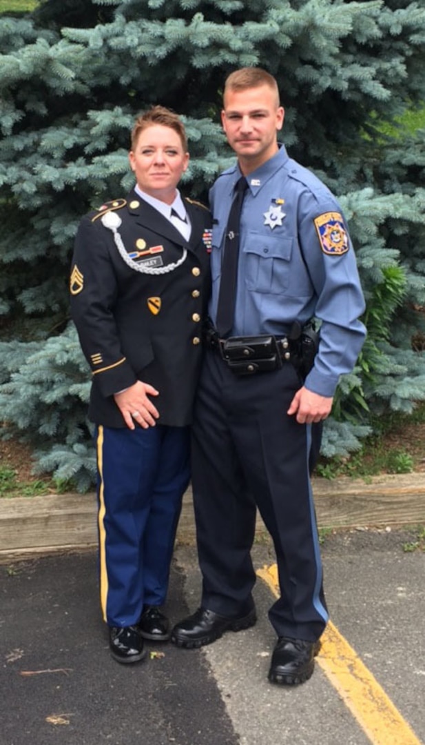 New York Army National Guard Staff Sgt. Tracie Bailey congratulates Sgt. Joseph Selchick on his successful graduation from the Rockland County Police and Public Safety Academy in Pomona, New York on June 23, 2017. Selchick and Bailey are military police Soldiers with the National Guard’s 727th Military Police Law and Order Detachment. 