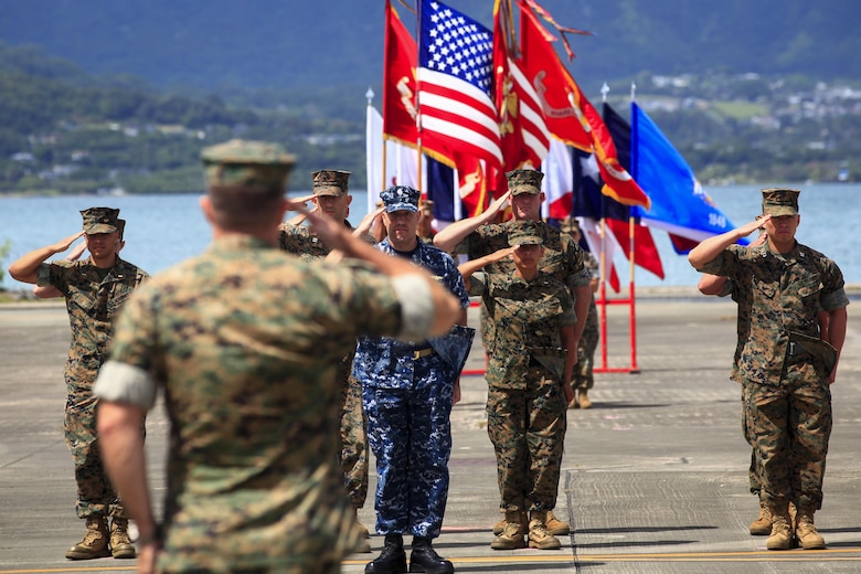 MARINE CORPS BASE HAWAII – Col. Sean C. Killeen and ceremonial staff render hand salutes during a change of command ceremony aboard Marine Corps Air Station Kaneohe Bay on June 23, 2017. During the Ceremony, Killeen also retired from the Corps after 34 years of honorable service. (U.S. Marine Corps photo by Cpl. Alex Kouns/Released)