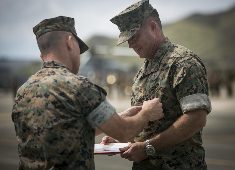 MARINE CORPS BASE HAWAII –  Maj. Gen. Joaquin F. Malavet, commanding general of Marine Corps Installations Pacific, awards Col. Sean C. Killeen with the Legion of Merit Medal gold star in lieu of second award during a change of command ceremony aboard Marine Corps Air Station Kaneohe Bay on June 23, 2017. During the ceremony, Killeen relinquished command of Marine Corps Base Hawaii to Col. Raul Lianez and he retired from the Corps after 34 years of honorable service. (U.S. Marine Corps photo by Sgt. Brittney Vella/Released)