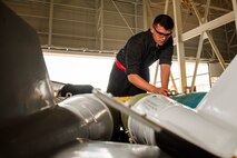 Senior Airman Brian Sanchez, 5th Aircraft Maintenance Squadron weapons load crew member, inspects training munitions before they are loaded into a B-52H Stratofortress at Minot Air Force Base, N.D., June 19, 2017. The training muntions were loaded into the aircraft by the 5th AMXS Global Strike Challenge team during their bomb-loading competition. (U.S. Air Force photo/Senior Airman J.T. Armstrong)