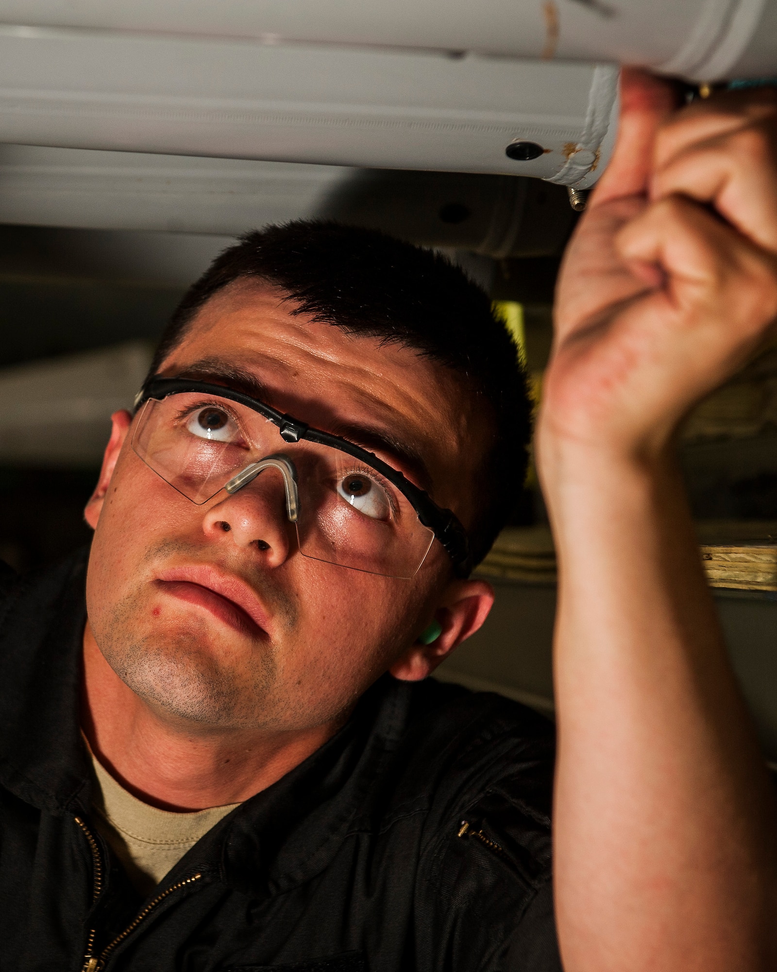 Senior Airman Brian Sanchez, 5th Aircraft Maintenance Squadron weapons load crew member, inspects training munitions before they are loaded into a B-52H Stratofortress at Minot Air Force Base, N.D., June 19, 2017. The training muntions were loaded into the aircraft by the 5th AMXS Global Strike Challenge team during their bomb-loading competition. (U.S. Air Force photo/Senior Airman J.T. Armstrong)